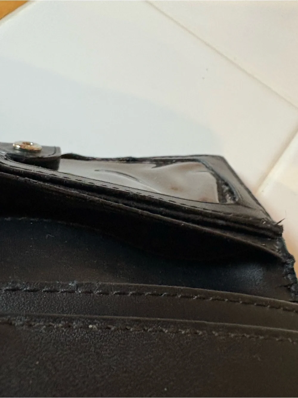 Kate Spade Black Pebbled Leather Wallet with Gold Plaque